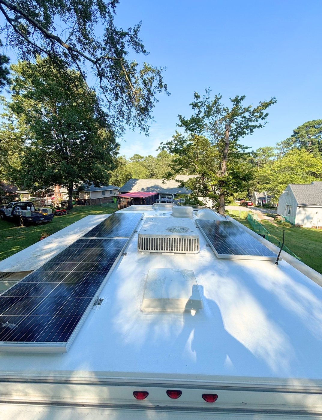 Finished white RV roof with solar panels